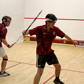 Students practicing inside Fisher Squash Center
