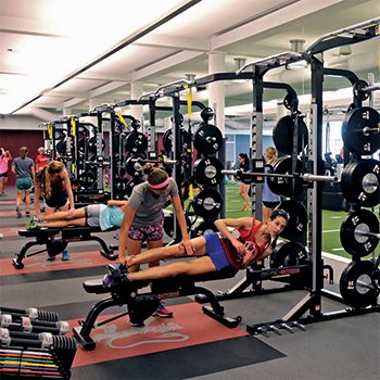 Students exercising in the Downer Family Fitness Center