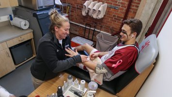 An athletic trainer helping an Exeter athlete in the Bravo Room